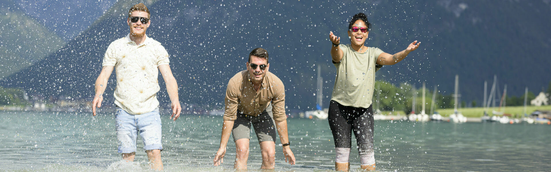 Employees of the Achensee region enjoy splashing about in the turquoise blue water of Lake Achensee.